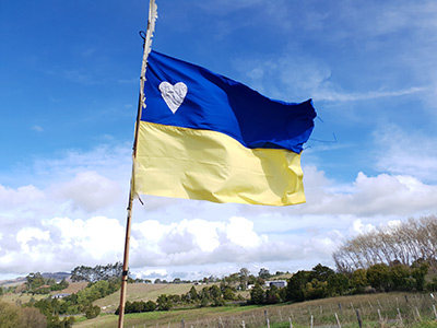 A handsewn Ukrainian flag made by Graham Hughes flying in the top paddock at McKinleyRd Creatives.